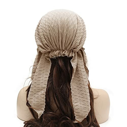 Back view of a mannequin wearing a beige textured headscarf.