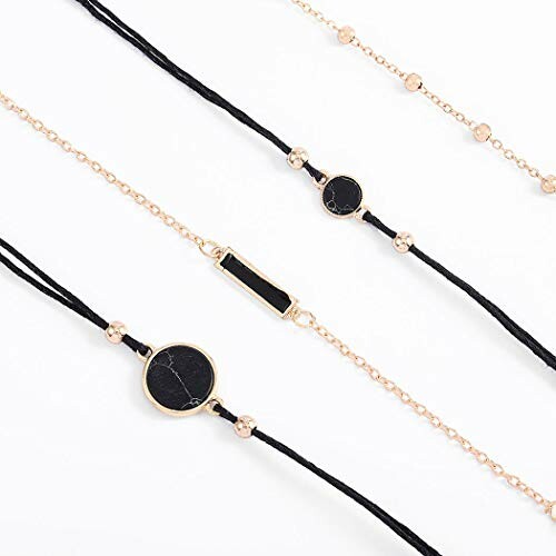 Layered bracelets with black and gold design