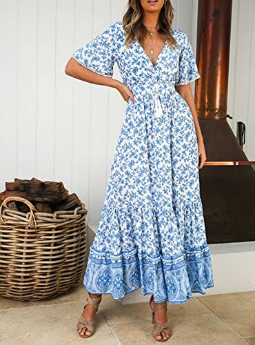 Woman wearing a blue floral maxi dress in a room with wicker basket and fireplace.