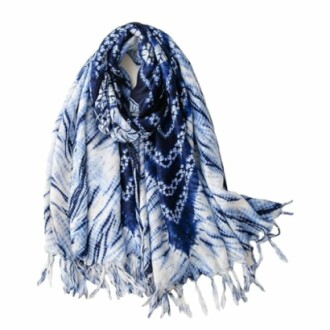 Blue and white patterned scarf with fringes.