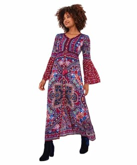Woman wearing a colorful bohemian maxi dress with long sleeves.