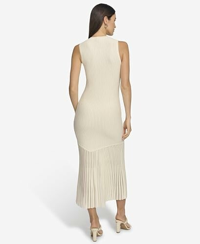Woman wearing a sleeveless knit dress, back view.