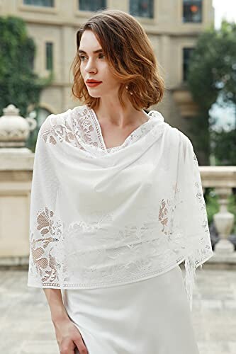 Woman wearing a white lace shawl outdoors