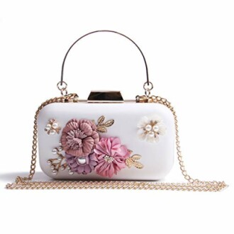 White clutch purse with floral decorations and gold chain