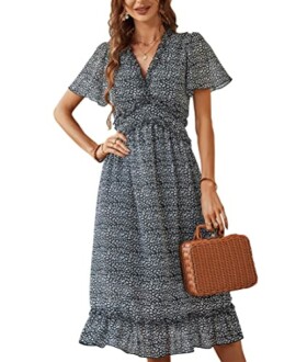 Woman in floral midi dress holding wicker bag