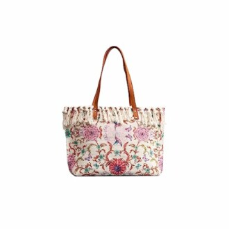 Floral tote bag with fringe and brown handles.