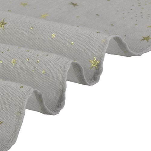 Close-up of grey fabric with gold star pattern