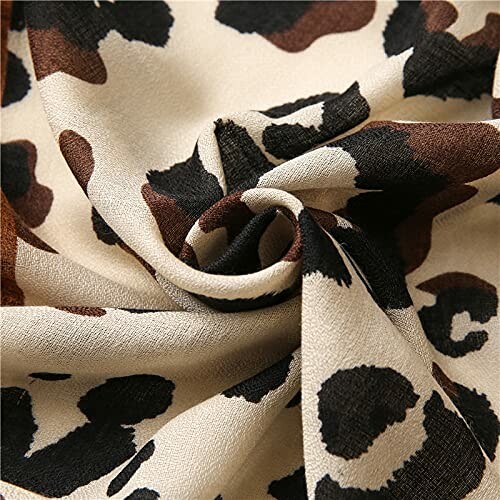 Close-up of leopard print fabric in brown and black.