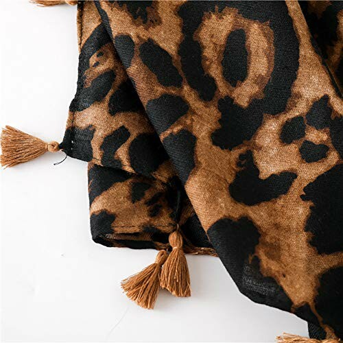 Leopard print scarf with tassels displayed elegantly