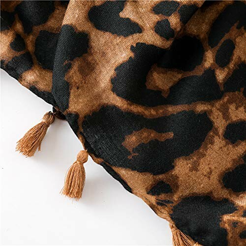 Leopard print scarf with tassels on a white background