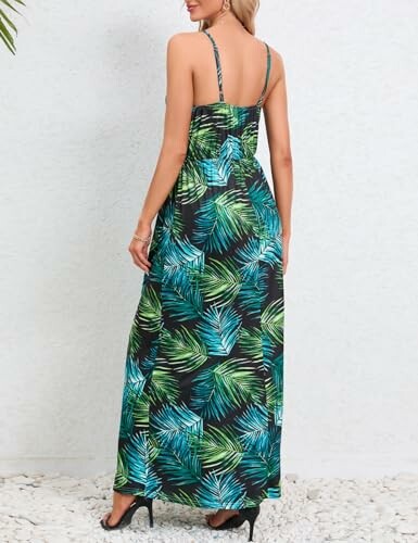 Back view of a woman wearing a tropical leaf print maxi dress and heels.