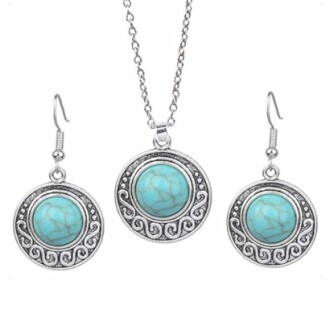 Turquoise necklace and earrings set with ornate silver design
