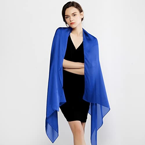 Woman wearing a blue silk shawl over a black dress