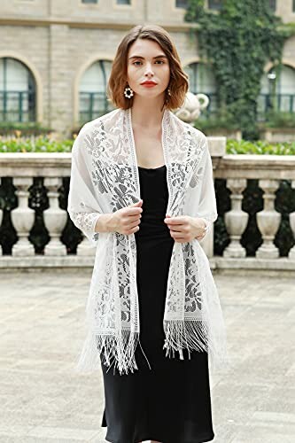 Woman in black dress with white lace shawl outdoors