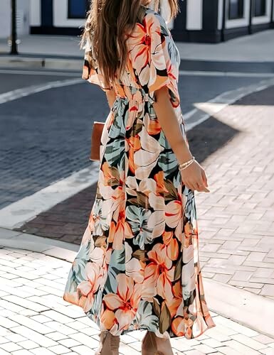 Woman in floral dress walking on a street