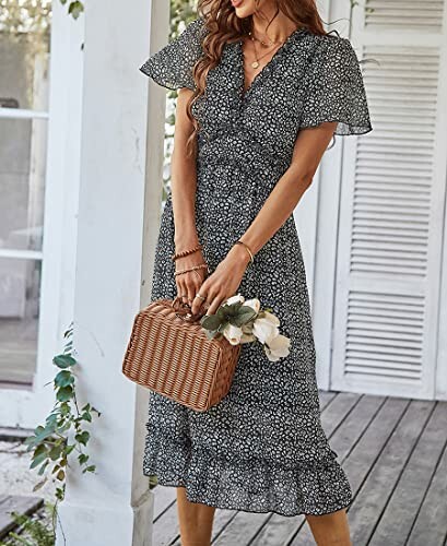 Woman in floral dress holding a wicker bag with flowers.