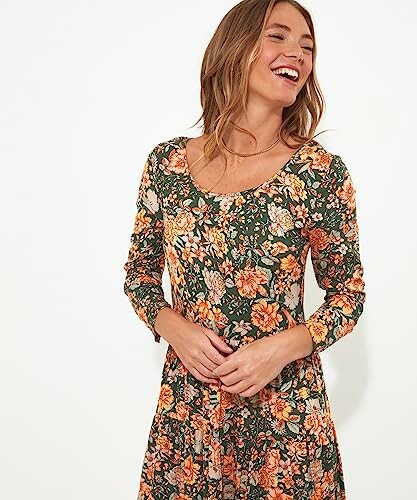 Woman wearing a floral dress smiling
