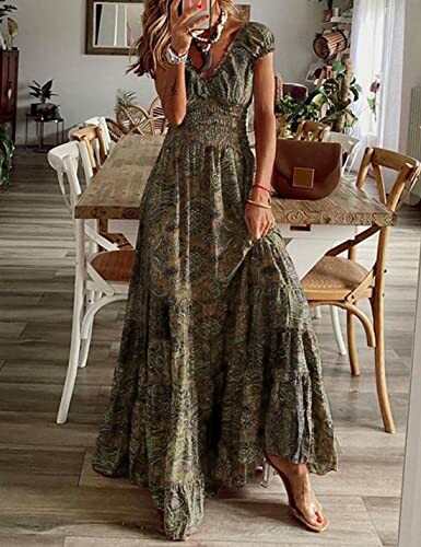 Woman wearing a bohemian dress standing by a dining table.