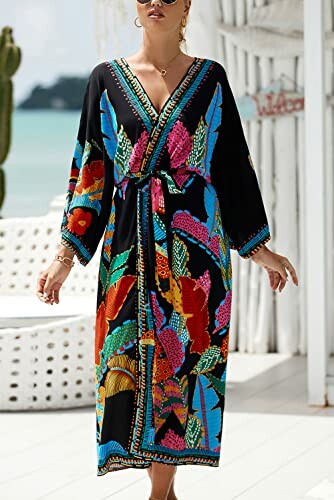 Woman wearing a colorful floral beach dress with a belt, standing outdoors.