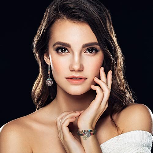 Woman posing with earrings and bracelet