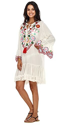 Woman in white dress with colorful embroidery
