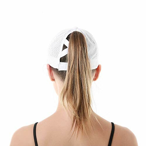 Back view of a woman wearing a white cap with a ponytail.