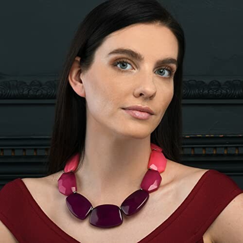 Woman wearing a bold, colorful statement necklace.