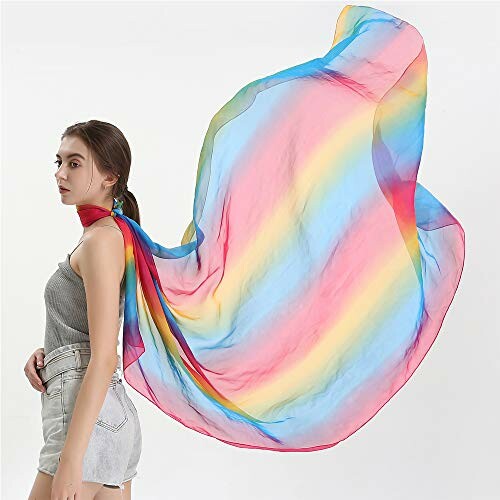 Woman wearing a flowing rainbow-colored scarf.