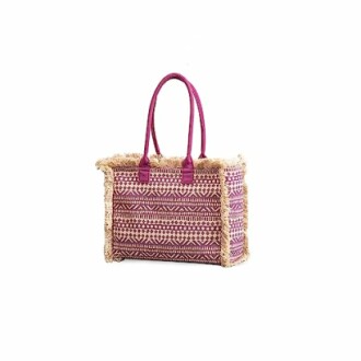 Woven tote bag with pink handles and decorative fringe