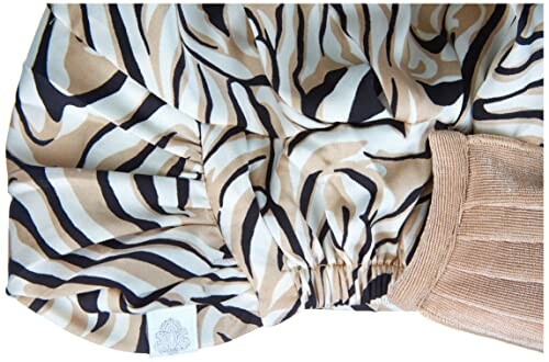 Zebra print satin bonnet with elastic band.